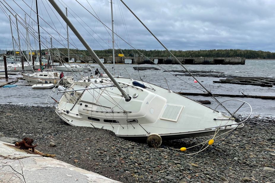 A sailboat lies washed up on shore Saturday in Shearwater, Nova Scotia.