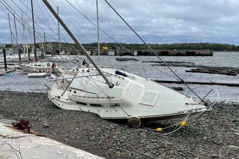 A sailboat washed ashore Saturday in Shearwater, Nova Scotia.