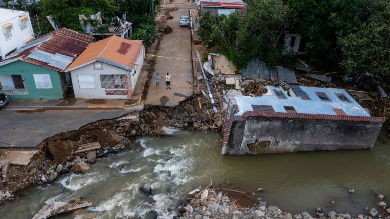 A destroyed road and home are seen in Guayama, Puerto Rico, days after Hurricane Fiona dropped over 20 inches of rain on the island.