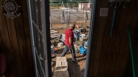 Luis Vasquez cleans out the yard of his one-bedroom beach house in Salinas.