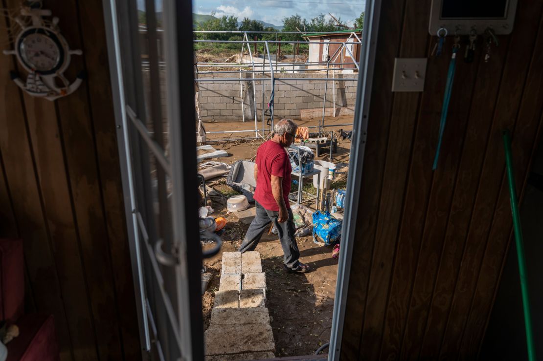 Luis Vasquez cleans out the yard of his one-bedroom beach house in Salinas.