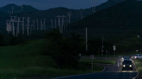 Power lines are seen at dusk in Guayama. Fiona knocked out power across the island, leaving half of its homes and businesses without lights five days after the storm. 
