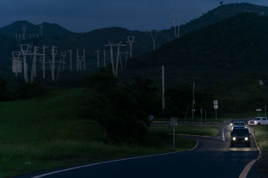 Power lines are seen at dusk in Guayama. Fiona knocked out power across the island, leaving half of its homes and businesses without lights five days after the storm.
