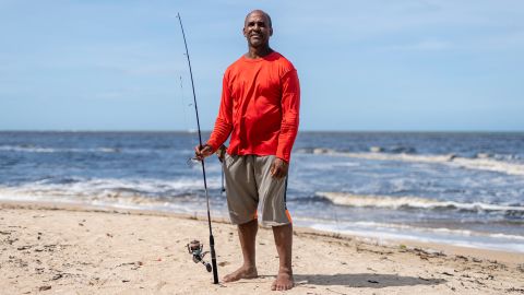 Jorje Calderon, a fisherman who has given away his catch, poses for a portrait in Loiza, Puerto Rico.