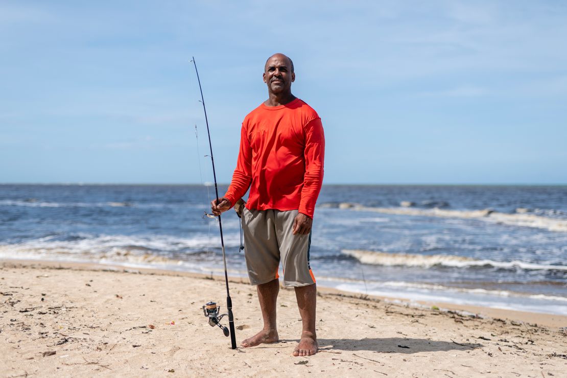 Jorje Calderon, a fisherman who has given away his catch, poses for a portrait in Loiza, Puerto Rico.