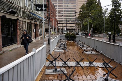 Restaurant tables are turned upside down in Halifax before Fiona on Friday, September 23.