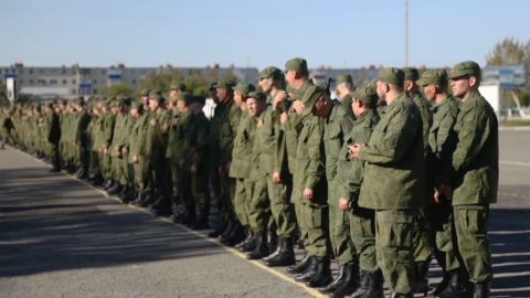 Newly drafted Russian men receive combat weapons in Petropavlovsk-Kamchatsky, Russia, on Sept. 23.