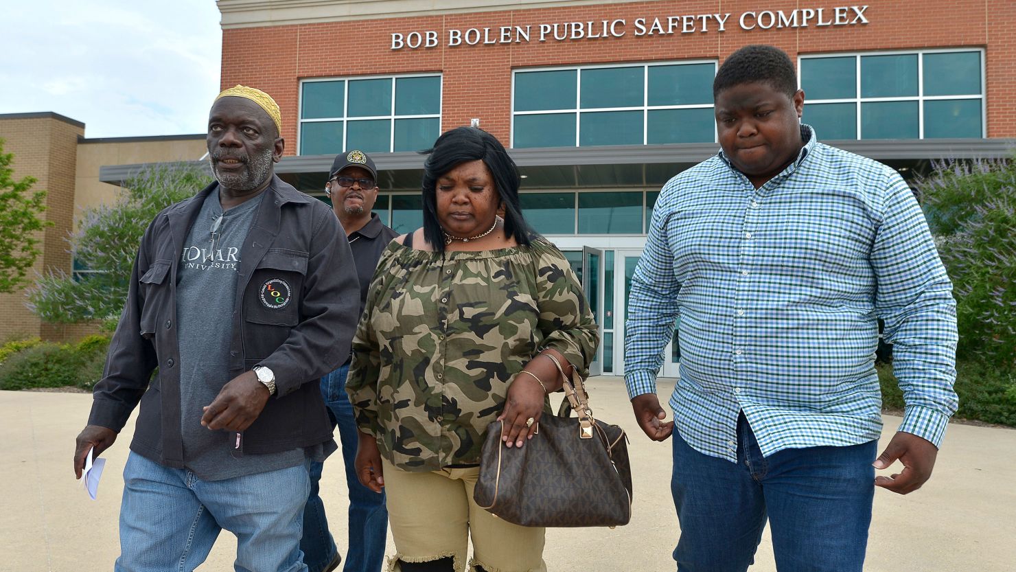 Pastor Michael Bell, left, accompanies Jacqueline Craig on Friday, May 19, 2017, at the Bob Bolen Public Safety Complex in Fort Worth, Texas. 