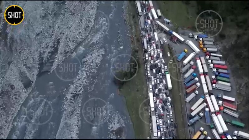 Video: Satellite images show 10-mile line of cars fleeing Russia