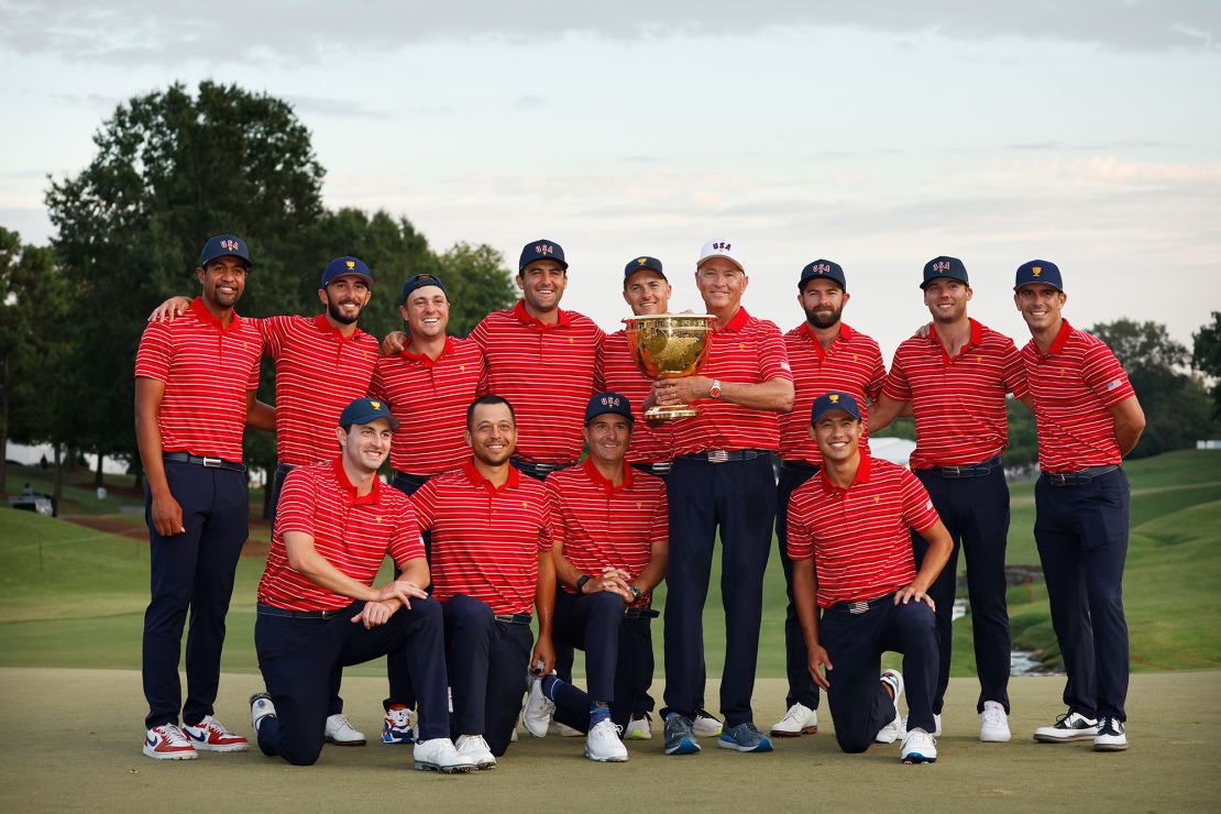 The victorious US Team poses with the Presidents Cup trophy.