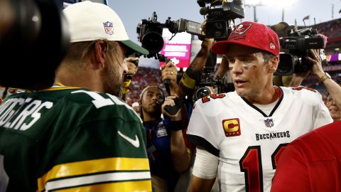 Rodgers (left) and Brady greet each other after Sunday's game. 