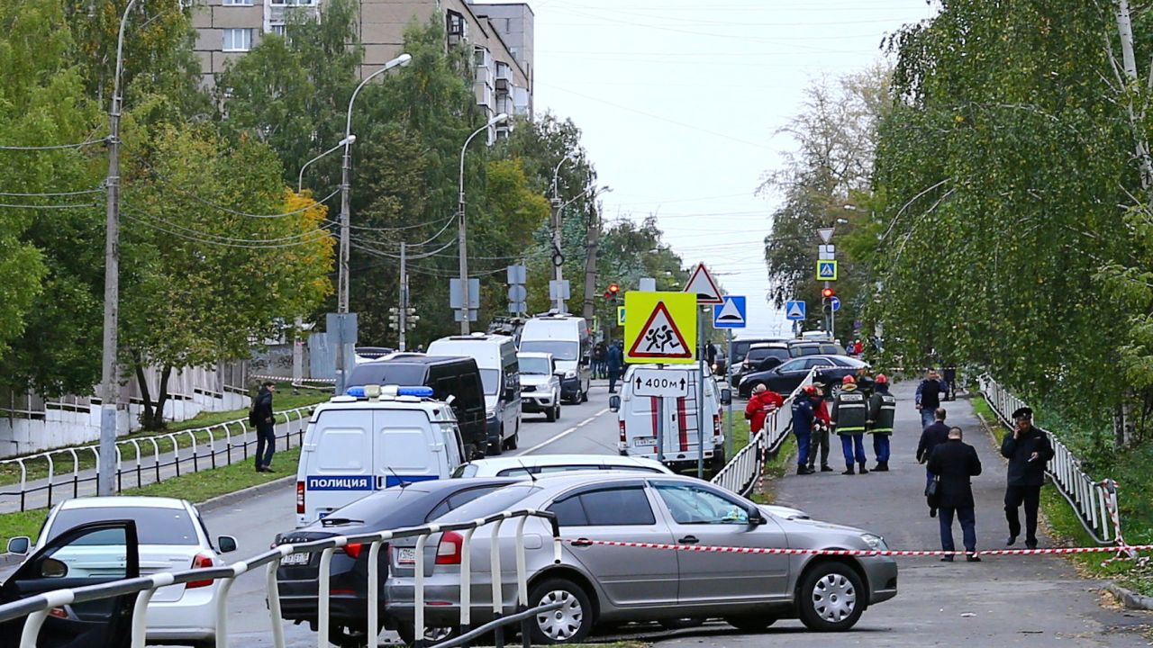 Police and emergency service workers near the scene of the school shooting in Izhevsk, Russia, on Monday.