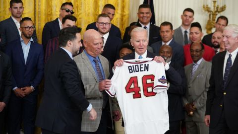 US President Joe Biden is presented an Atlanta Braves jersey in the East Room of the White House in Washington, DC, on September 26, 2022, as he hosts a celebration for the Braves following their 2021 World Series championship.
