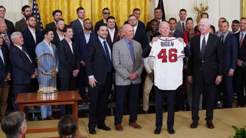 US President Joe Biden holds a jersey presented to him during an event in honor of the 2021 World Series champions the Atlanta Braves in the East Room of the White House in Washington, DC on September 26, 2022. (Photo by Mandel NGAN / AFP) (Photo by MANDEL NGAN/AFP via Getty Images)
