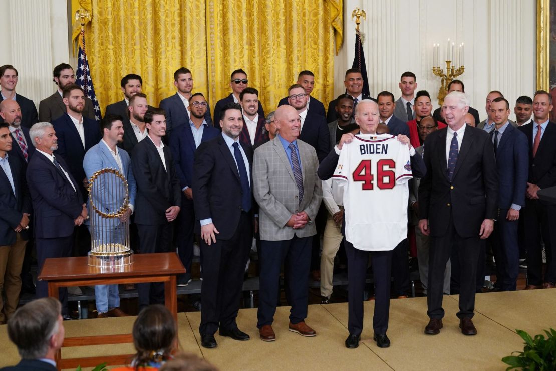 US President Joe Biden holds a jersey presented to him during an event in honor of the 2021 World Series champions the Atlanta Braves in the East Room of the White House in Washington, DC on September 26, 2022. (Photo by Mandel NGAN / AFP) (Photo by MANDEL NGAN/AFP via Getty Images)
