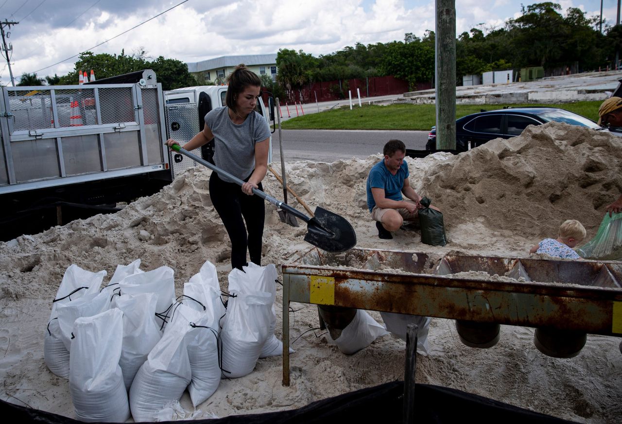 Sarah Peterson fills sandbags in Fort Myers Beach, Florida, on Saturday, September 24.