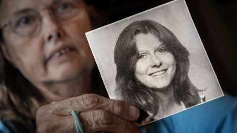 Veronique Duperly holds a photo of her sister, Patricia Agnes Gildawie, who went missing in February 1975.