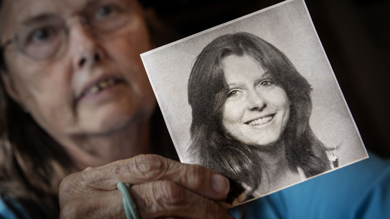 Veronique Duperly holds a photo of her sister, Patricia Agnes Gildawie, who went missing in February 1975.