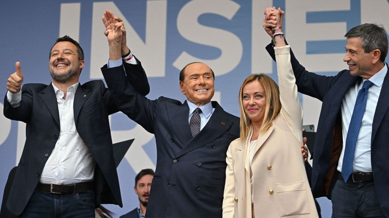 TOPSHOT - (From L) Leader of Italian far-right Lega (League) party Matteo Salvini, Forza Italia leader Silvio Berlusconi, leader of Italian far-right party "Fratelli d'Italia" (Brothers of Italy) Giorgia Meloni, and Italian centre-right lawmaker Maurizio Lupi stand on stage on September 22, 2022 during a joint rally of Italy's coalition of far-right and right-wing parties Brothers of Italy (Fratelli d'Italia, FdI), the League (Lega) and Forza Italia at Piazza del Popolo in Rome, ahead of the September 25 general election. (Photo by Alberto PIZZOLI / AFP) (Photo by ALBERTO PIZZOLI/AFP via Getty Images)