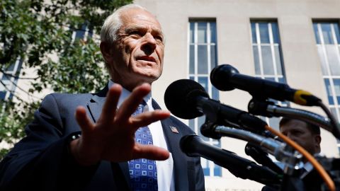  Former Trump White House adviser Peter Navarro talks briefly with reporters on August 31, 2022, in Washington, DC.