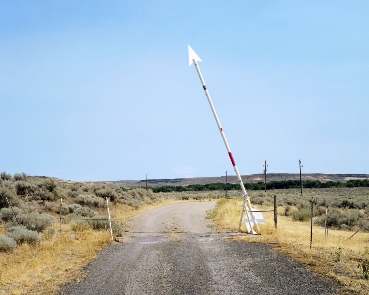 Horvath wove photos of found arrows (pictured here on a road to White Arrow Ranch, a private resort just north of Bliss) throughout the book to represent a sense of direction — or misdirection.