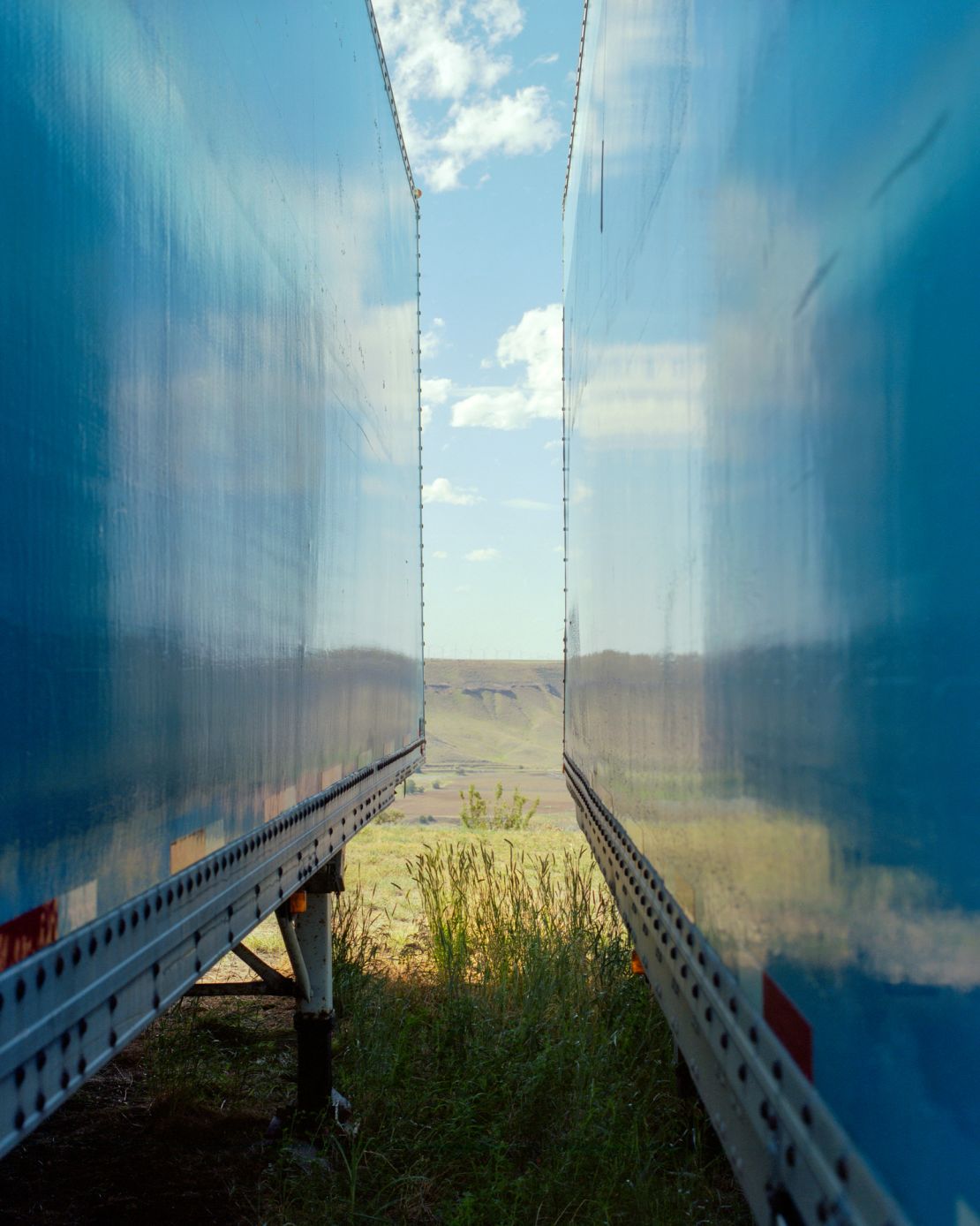 Horvath worked to capture a sense of place and mood around Bliss, and was drawn to this scene between two trucks for its visual illusion.