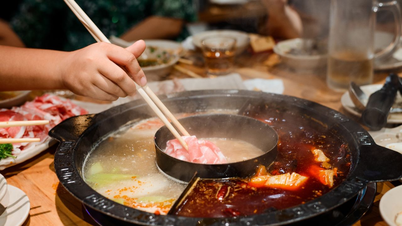 Hot pot can involve a range of meats and veggies cooked in a bubbling, spicy broth.