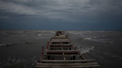 Waves churned under dark skies off the coast of Batabano, Cuba, on Monday.