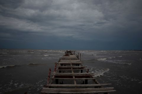 Waves whip up against dark skies off the coast of Batabano, Cuba.