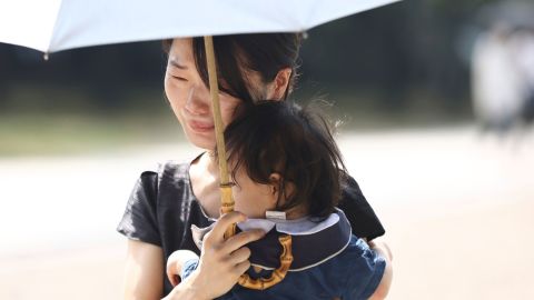 People gather to mourn Shinzo Abe at a shrine in Osaka City, Japan, on September 27.