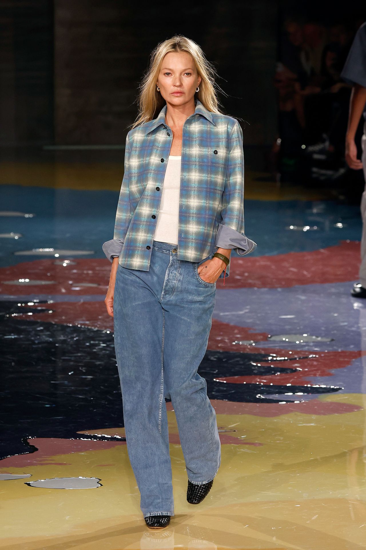 Kate Moss appeared in the Bottega Veneta show wearing leather trompe l'oeil pieces designed to look like flannel and denim. 