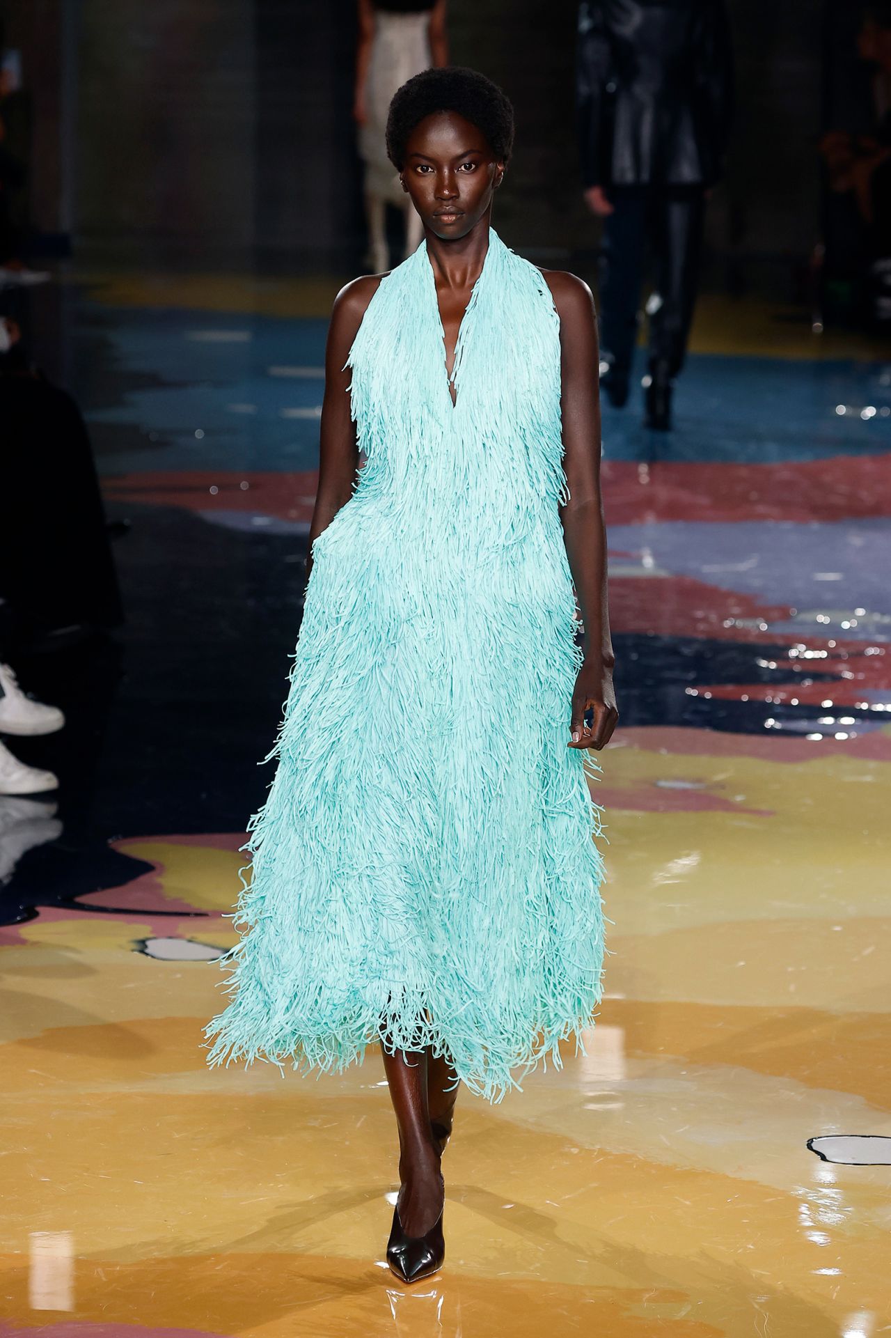 The final look from the Bottega Veneta catwalk was a turquoise fringed dress.