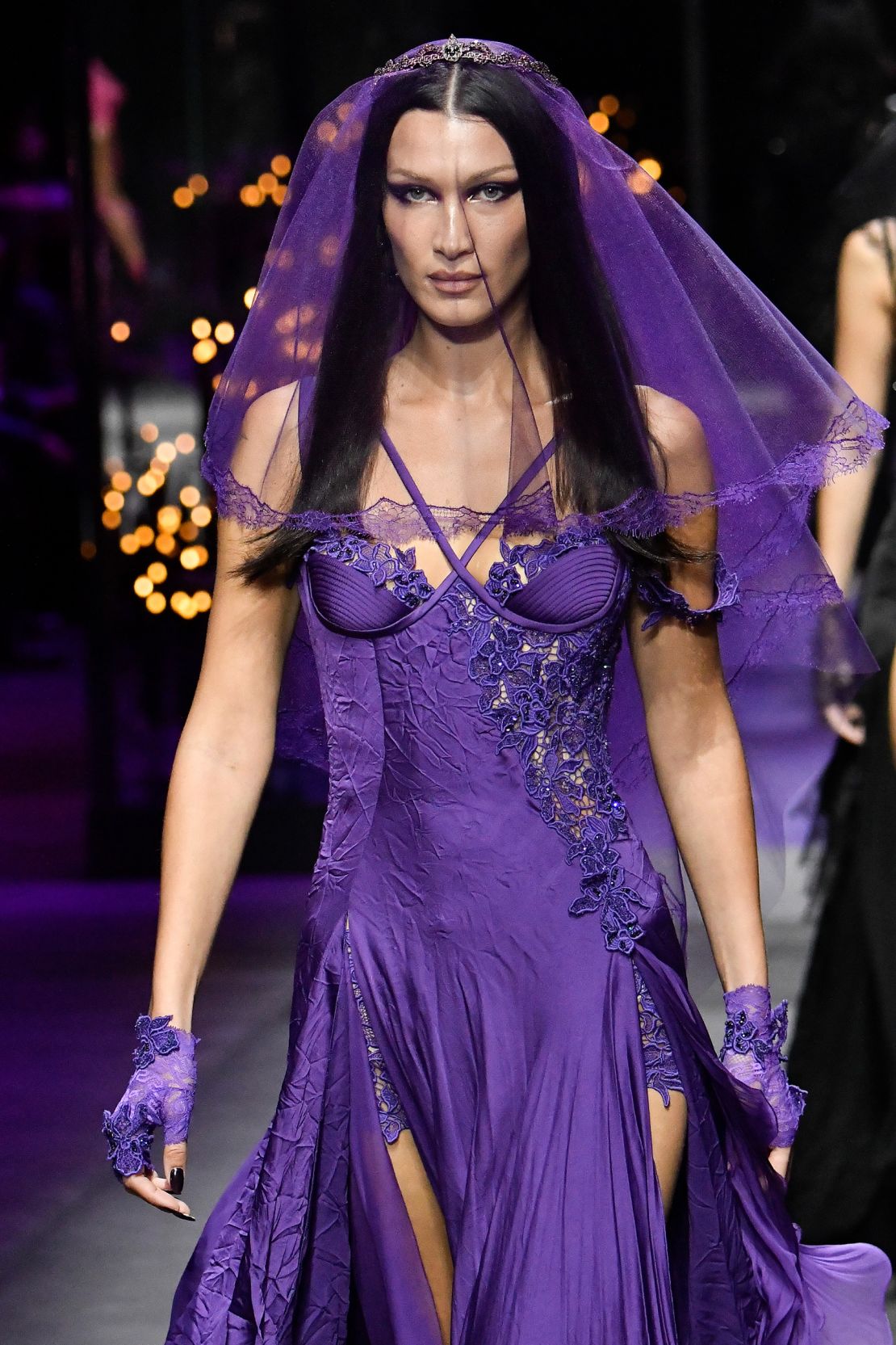 Bella Hadid made an appearance in a gothic purple veil and corset.