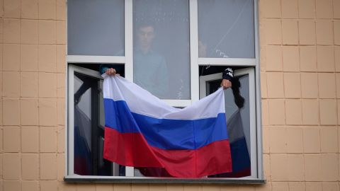 A Russian flag is displayed at the Pedagogical University in Ukraine's eastern region of Luhansk, which is controlled by Russia-backed separatists on Tuesday.