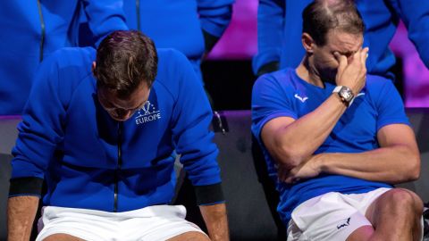 Federer (left) and Nadal watch a video montage after their Laver Cup doubles match. 