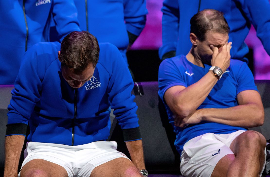 Federer (left) and Nadal watch a video montage after their doubles match at the Laver Cup. 