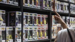 A man points to a shelf of 'Funko Pop' items at the tenth edition of DreamHack, at the Forum center Feria Valencia, on July 1, 2022, in Valencia, Spain. 