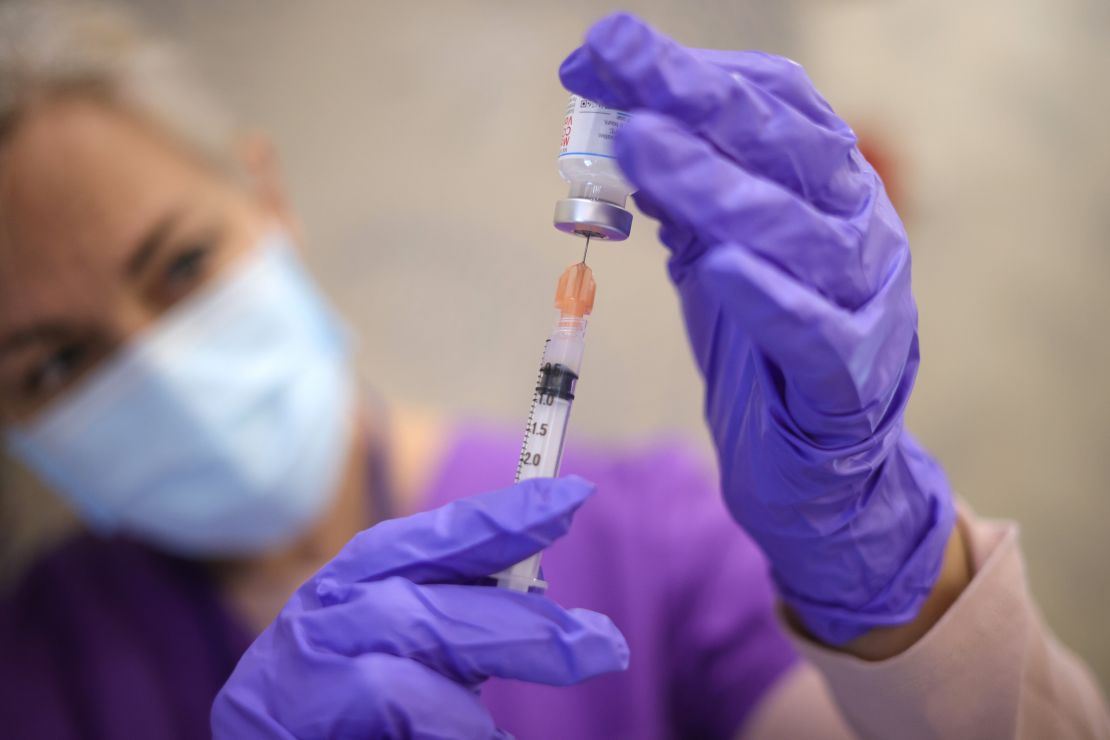 A nurse draw vaccine doses from a vial as people receive their second dose of a Covid-19 vaccine on March 25, 2021 in Bowie, Maryland.