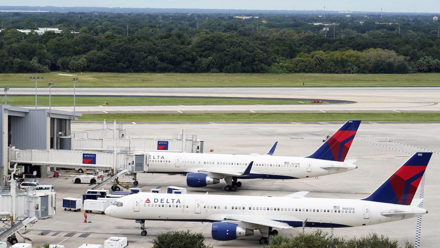 A Delta Airlines Boeing 757 pushes back from the gate at the Tampa International Airport Tuesday, Sept. 27, 2022, in Tampa, Fla. The airport is closing at 5pm today ahead of a potential landfall by Hurricane Ian. Ian is predicted to hit somewhere along Florida's west coast. (AP Photo/Chris O'Meara)
