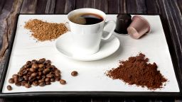 Espresso cup, coffee beans, ground coffee, coffee capsule and instant coffee