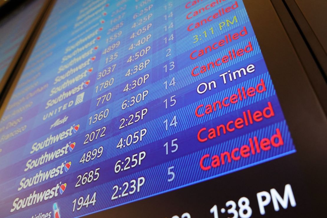 The arrival and departures board lists numerous flight cancellations at Tampa International Airport before its scheduled 5 p.m. Tuesday closure. 