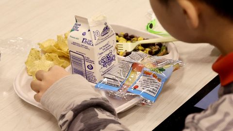 A student eats a vegan meal served for lunch (with milk as a drink) at Yung Wing School P.S. 124 in New York City. The Department of Education in New York City started phasing in "vegan-focused" menus on Fridays or "Vegan Fridays" since February as part of Mayor Eric Adams' initiative to serve healthier food to students.