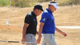 KING ABDULLAH ECONOMIC CITY, SAUDI ARABIA - FEBRUARY 02: Ian Poulter of England and Phil Mickelson of the United States of America walk on the 3rd hole during Day 4 of the Saudi International at Royal Greens Golf and Country Club on February 02, 2020 in  King Abdullah Economic City, Saudi Arabia. (Photo by Andrew Redington/WME IMG/WME IMG via Getty Images)