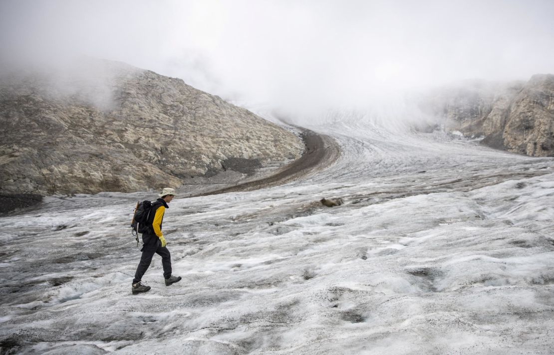Huss walking on the Gries glacier.