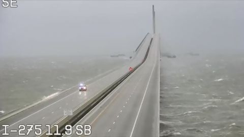 An emergency vehicle travels Wednesday morning on the Sunshine Skyway over Tampa Bay. 