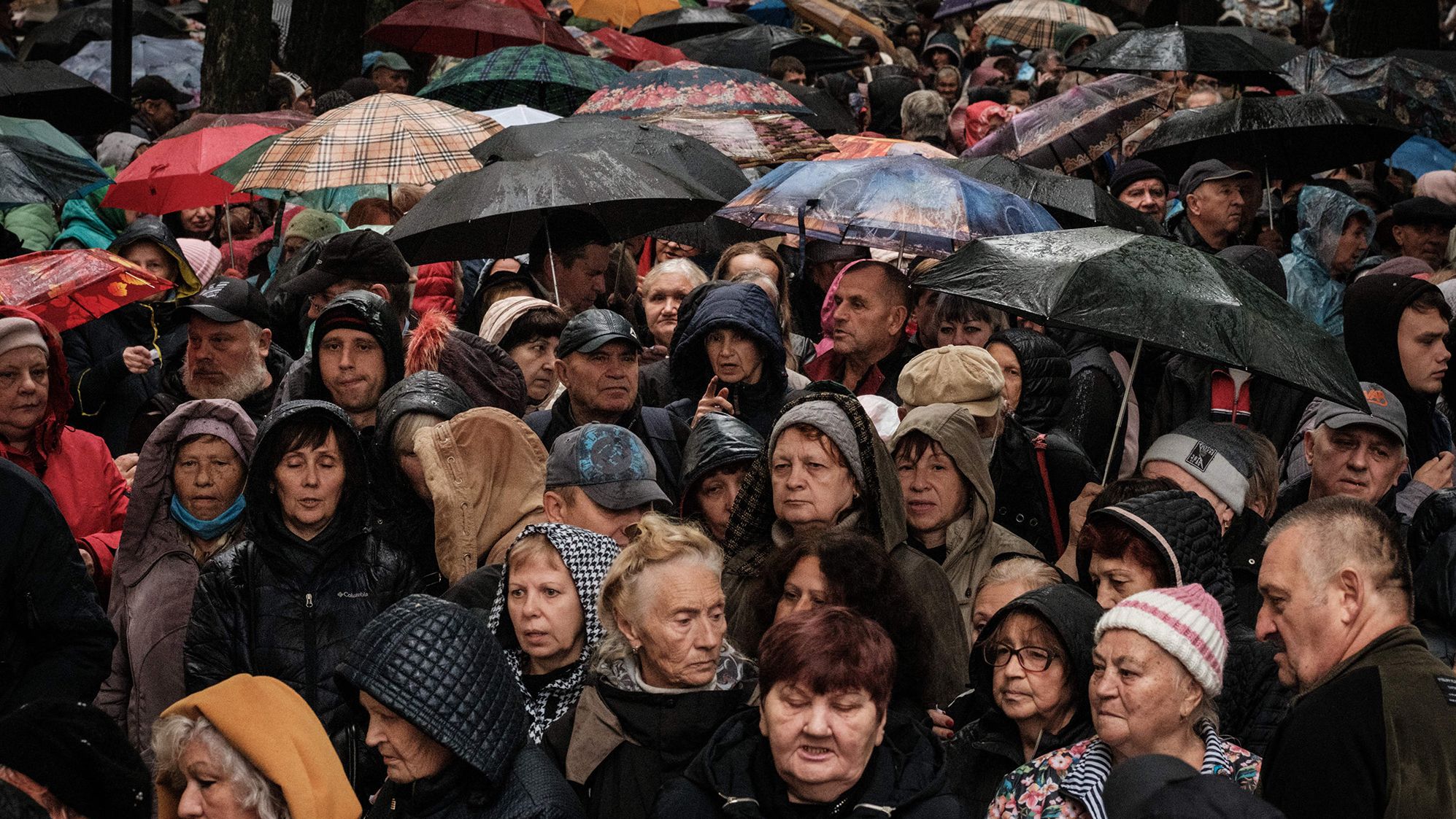 People wait for food aid distributed by the local branch of Caritas Internationalis, a Catholic charity organisation, in Kharkiv, Ukraine, on September 27.