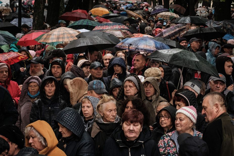 People wait for food aid distributed by the local branch of Caritas Internationalis, a Catholic charity organisation, in Kharkiv, Ukraine, on September 27.