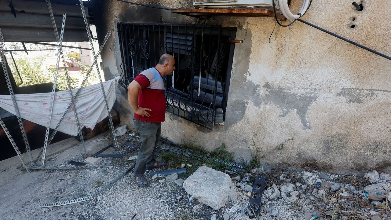 A Palestinian man checks for damage after an Israeli raid in Jenin on Wednesday.