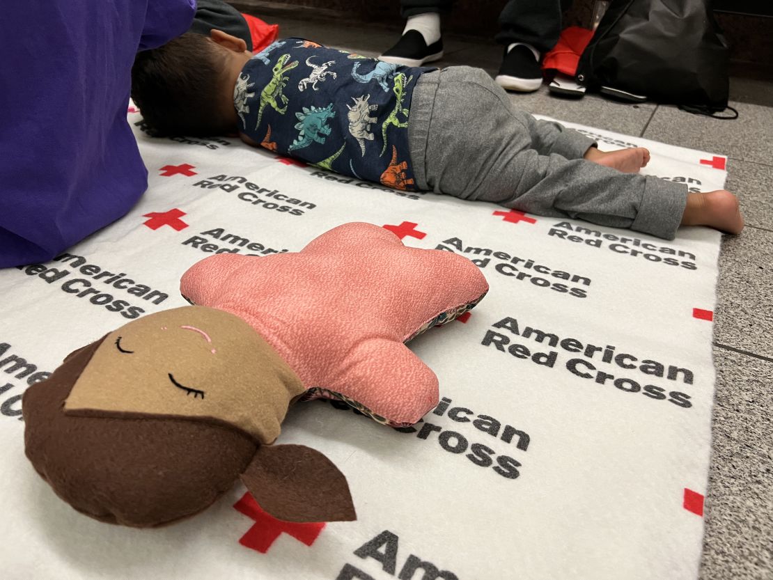 A child sleeps at the El Paso airport after his family's one month journey from Venezuela. According to the child's father, the family is seeking asylum in the United States. 