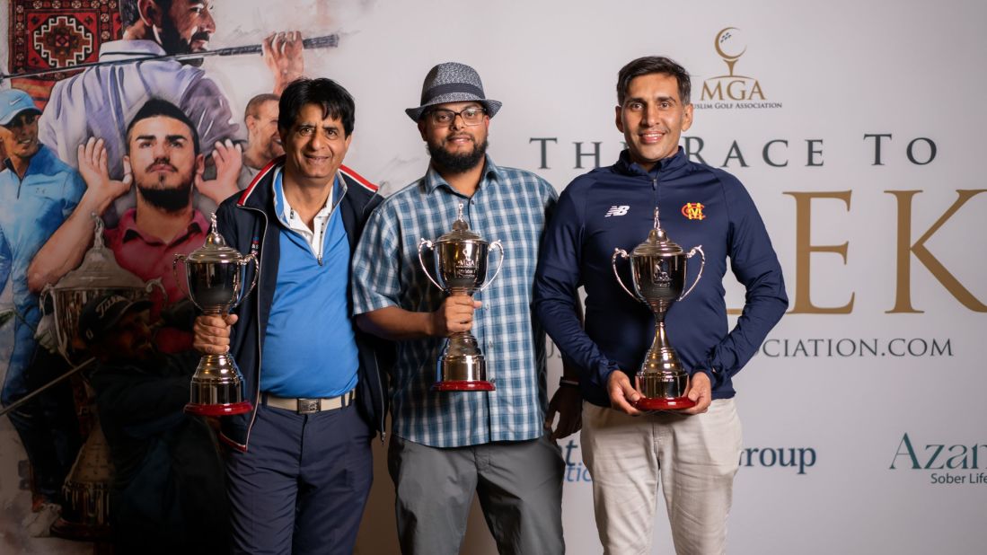 Race to Belek winners Tariq Mahmood, Ahmed Sherman, and Asad Khan celebrate their trophies after being crowned champions at the Forest of Arden Club in August.